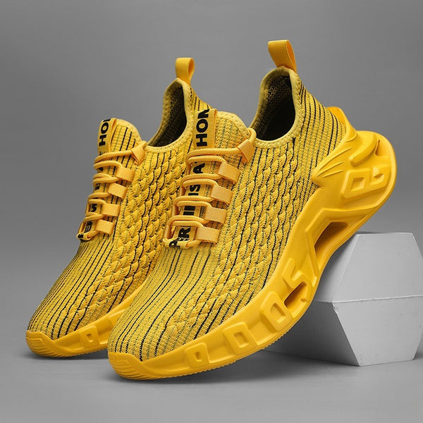 Yellow sneakers with black text on a gray background