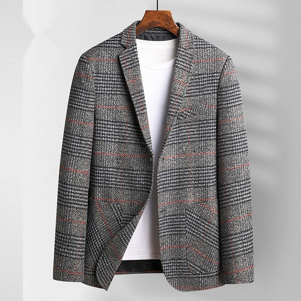 Plaid patterned coat on a hanger against a plain background