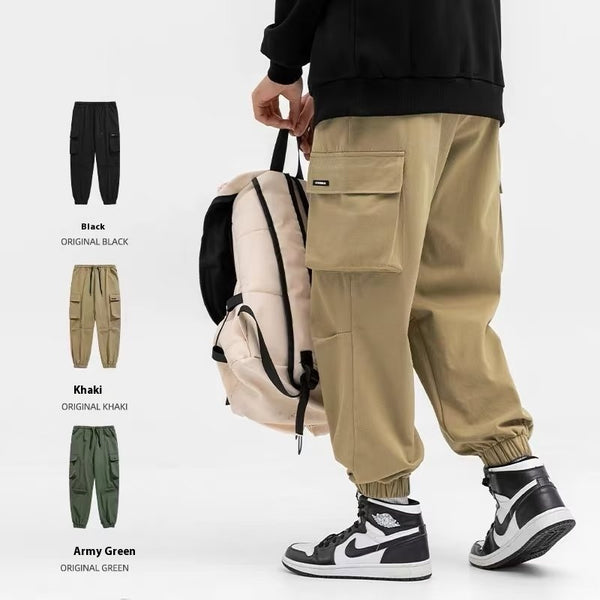 Person wearing beige cargo pants with color options displayed on a white background