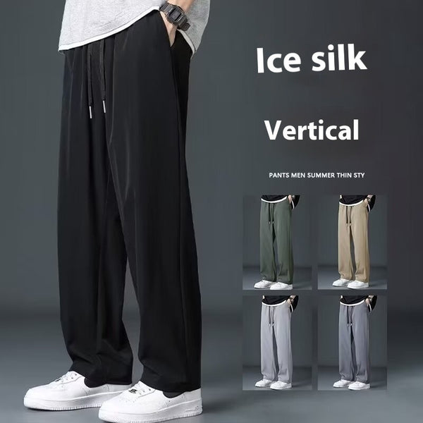 Person wearing black ice silk vertical pants with inset images of different colors on a gray background.