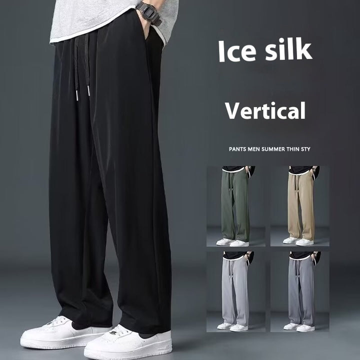 Person wearing black ice silk vertical pants with inset images of different colors on a gray background.